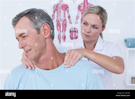 Doctor Stretching Her Patient Neck Stock Photo Alamy