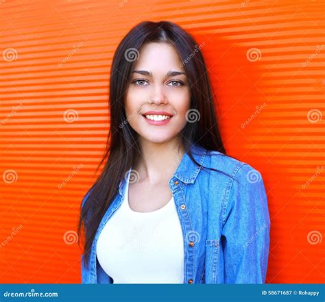 Portrait Of Beautiful Happy Smiling Brunette Woman In Jeans Stock Image