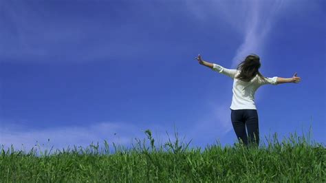 Young Happy Woman Is Running And Jumping By The Camera