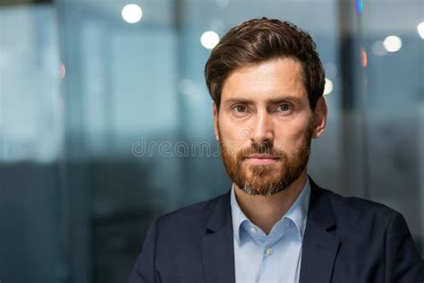 closeup portrait of mature serious businessman professional investor man looking at camera with