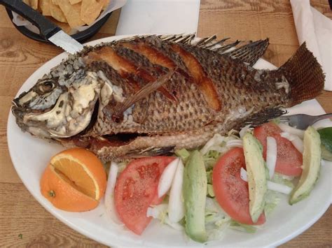 Watch this video to see how they do it. This scrumptious dish is called "MOJARRA FRITA" which is a ...