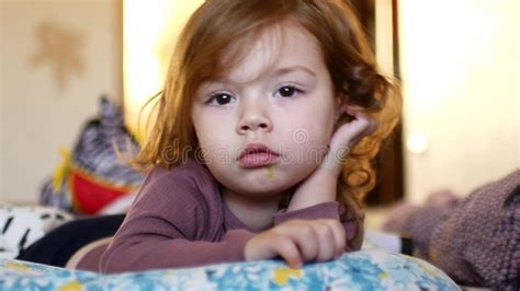 Little Sleepy Girl The Child Lies On The Bed And Struggles With Sleep