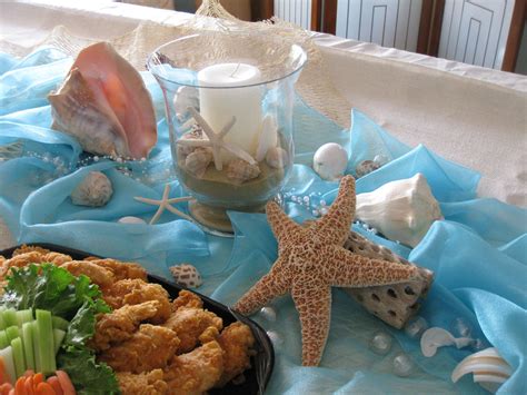 Per her request, it was a beach theme, and after lots of planning and making, i think we did a pretty good job! Beach Baby Shower - Centerpiece | Ocean baby shower theme ...