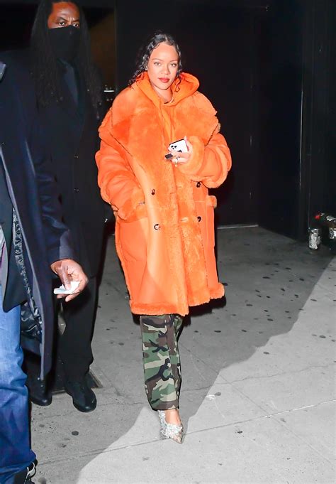 Rihanna Steps Out In A Bright Orange Coat And Matching Hoodie For A