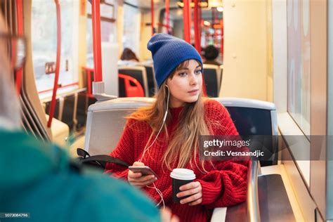 Young Woman Riding In Public Transportation High Res Stock Photo