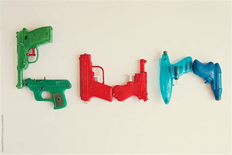 A Collection Of Vintage Toy Squirt Guns Water Pistols Arranged To
