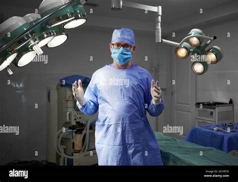 Portrait Of Surgeon Looking At Camera While Standing In Operating Room