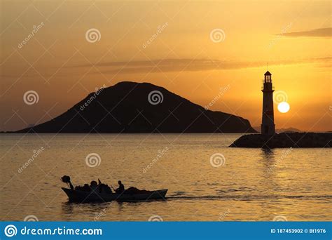 Seascape At Sunset Lighthouse On The Coast Seaside Town Of Turgutreis