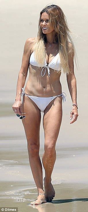 Neighbours Emma Harrison Turns Heads In White Bikini On The Beach Daily Mail Online