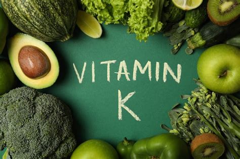 Premium Photo Vegetables Fruits And Text Vitamin K On Green Background