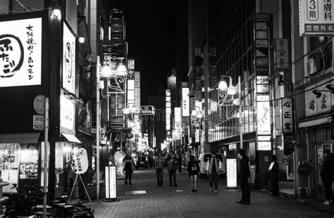 Black And White Of Nightlife On A Busy Street In Tokyo Full Of