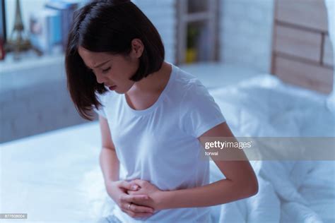 Asian Women Her Stomach Aches Hard She Wakes Up In The Middle Of The Night While She Sleeps High