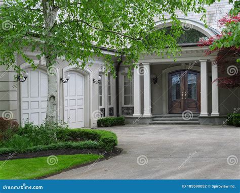 Elegantly Landscaped House With Circular Driveway Stock Photo Image