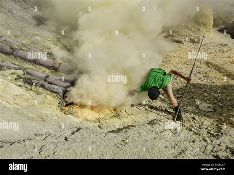 Sulphur Miner Working In Extremely Harsh Environment To Extract Sulphur