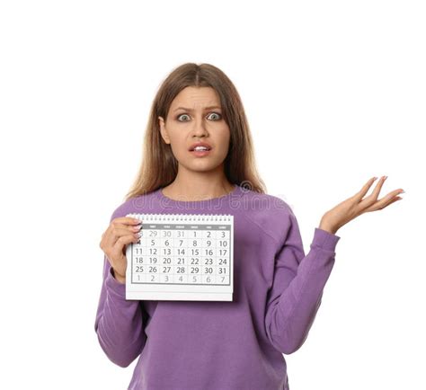 Emotional Young Woman Holding Calendar With Marked Menstrual Cycle Days