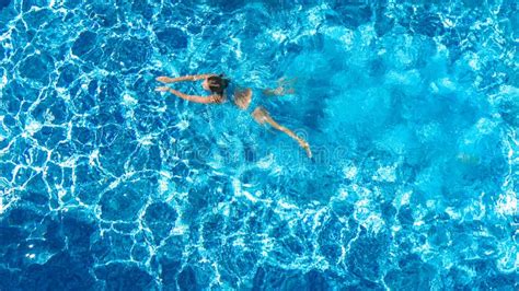 Active Girl In Swimming Pool Aerial Drone View From Above Young Woman