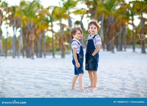 Two Little Kids Boys Having Fun On Tropical Beach Happy Best Friends