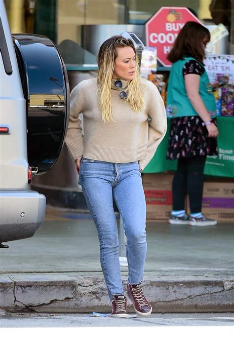 Hilary Duff Keeps It Casual In A Beige Sweater And Tight Denim While