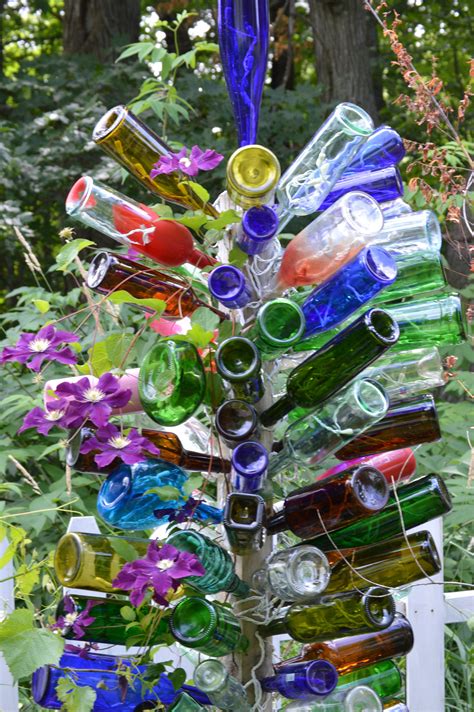 Diy How To Make A Bottle Tree For Your Garden Wine Bottle Diy Crafts Wine Bottle Crafts