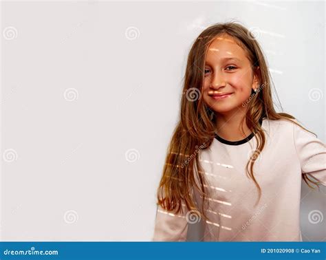 Portrait Of Cute Blond Little Girl With Sun Lights On White Background