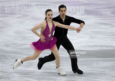 Two People Skating On An Ice Rink During The Winter Olympics In Soch