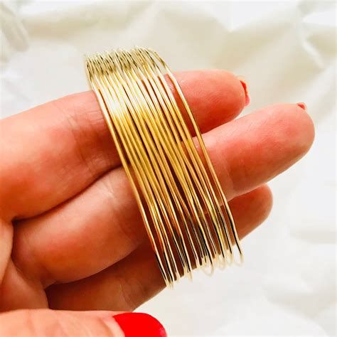 Set Of Thin 1mm Stacking Bangles Solid 14k Gold Stack Of Etsy In 2020 Solid Gold Bangle 14k