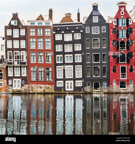 Famous Dancing Houses And Buildings In Amsterdam With Reflection In