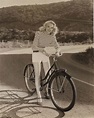 Martha Tilton rides a bike