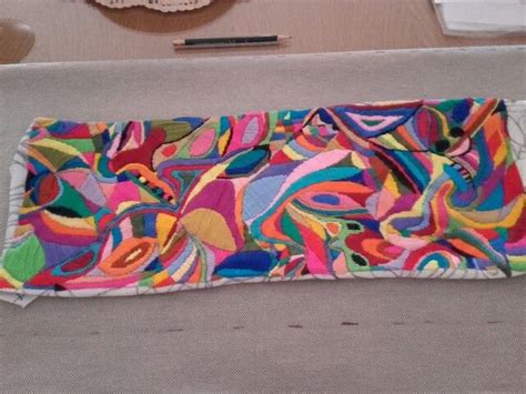 A Multicolored Piece Of Cloth Is Laying On The Floor