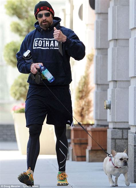 Hugh Jackman Dons Bright Glove Style Trainers While Jogging With Dog