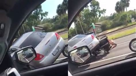 Car Runs Over Motorcycle In Bizarre Road Rage Incident Caught On Video