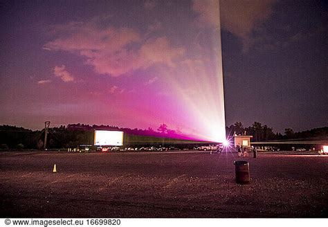 drive in movie theater with light beam in sky drive in movie theater with light beam in sky