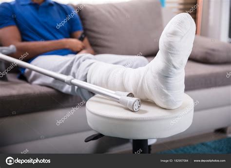 Close Man Broken Leg Crutches — Stock Photo © Andreypopov 182957084