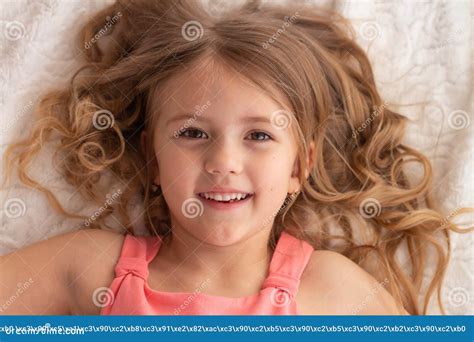 beautiful blonde girl lying on the bed stock image image of female nose 216484881