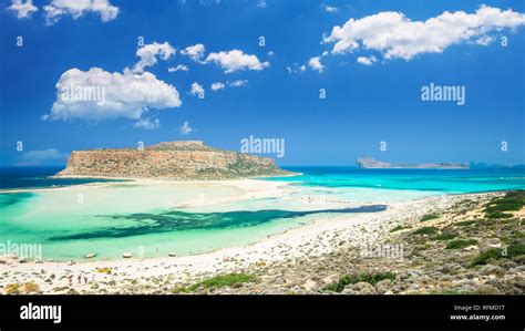 Balos Lagoon On Crete Island Greece Tourists Relax And Bath In