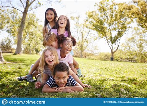 Children Lying On The Grass Happy And Joyful Brothers And Sisters Top