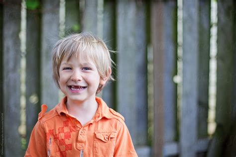 Happy Blonde Boy With Missing Front Teeth By Stocksy Contributor