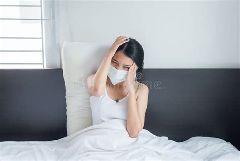 Asian Woman Have A Headache Using Protective Mask With Cold Blowing And