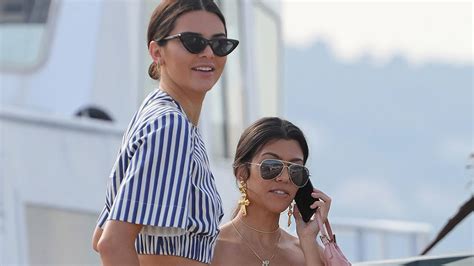 Kourtney Kardashian And Kendall Jenner Walk In Heels On The Beach