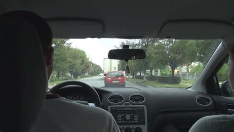 A man on the outside, he was destined to reveal. BUCHAREST ROMANIA - FEBRUARY 20, 2015 Inside Car Man Driving, Woman In The Passenger Seat, Drive ...