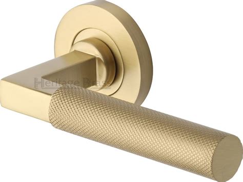 An Image Of A Brass Toilet Paper Holder With The Handle On Its Side