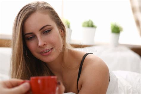 Blond Woman Have Cup Of Tea Coffee Early Morning In Her Bed Stock Image