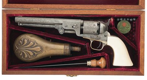 cased engraved colt model 1851 navy percussion revolver with ivory grip and accessories