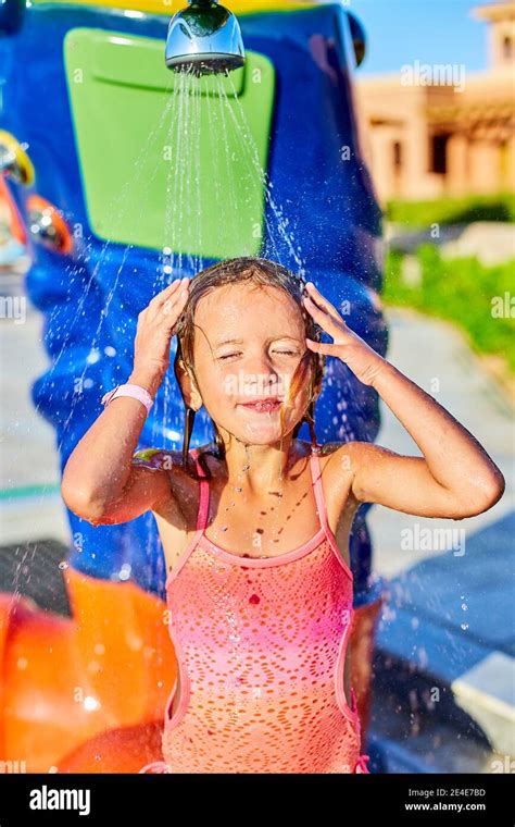 Funny Little Girl In Swimsuit Cooling In Shower Outside Child Play