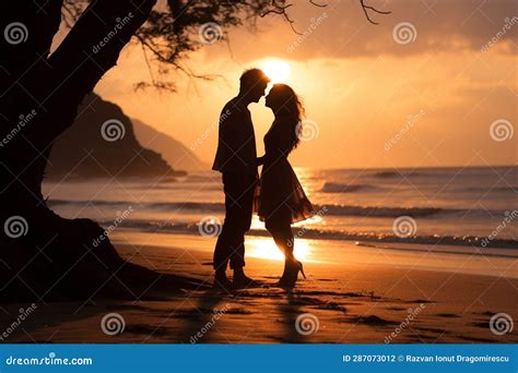 Against The Backdrop Of A Breathtaking Sunset A Deeply In Love Couple Shares An Intimate And