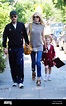 Claudia Schiffer and her husband Matthew Vaughn hold hands as they walk ...