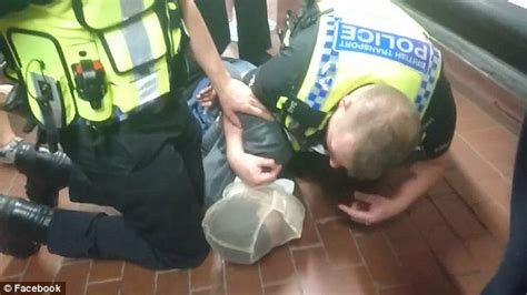 British Police Tackle Black Man To Floor And Put Mask Over Him After
