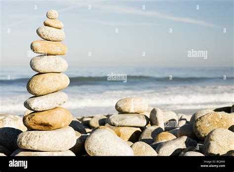 Stacked Pebbles By The Ocean Stock Photo Alamy