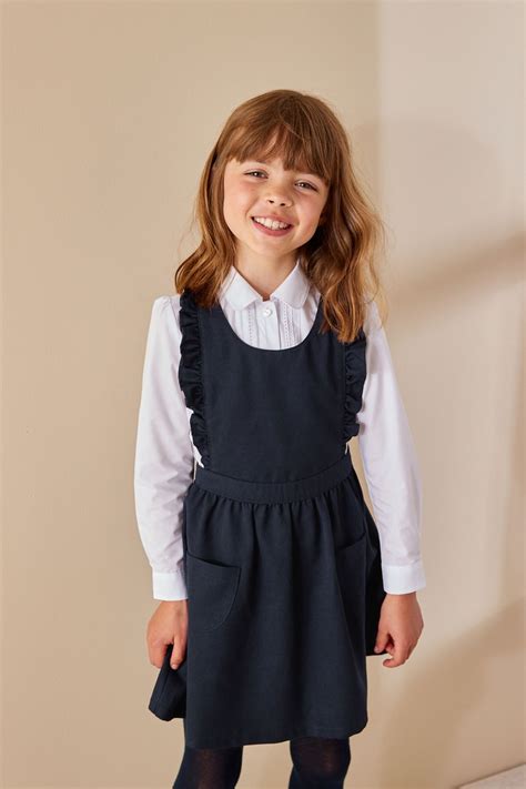 Buy Navy Blue Ruffle Detail Pinafore School Dress 3 14yrs From The Next Uk Online Shop