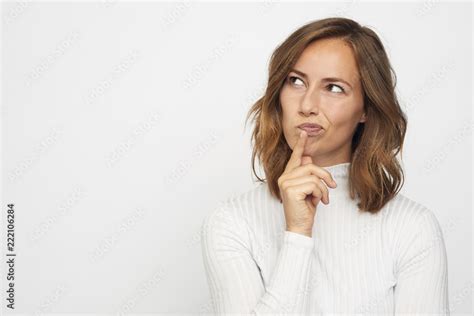 Portrait Of Young Woman Thinking Looks Left Stock Photo Adobe Stock